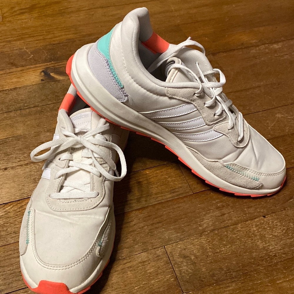 Adidas women’s shoe size 11. Cream, white, orange and teal.